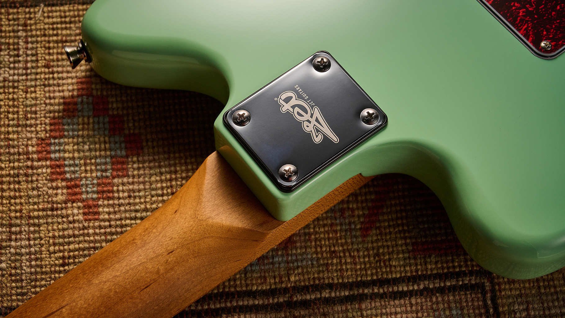 The neck plate of the Jet JJ-300 P90 electric guitar