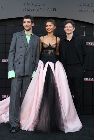 Zendaya stands with her Challengers costars on the Challengers Los Angeles red carpet in custom vera wang