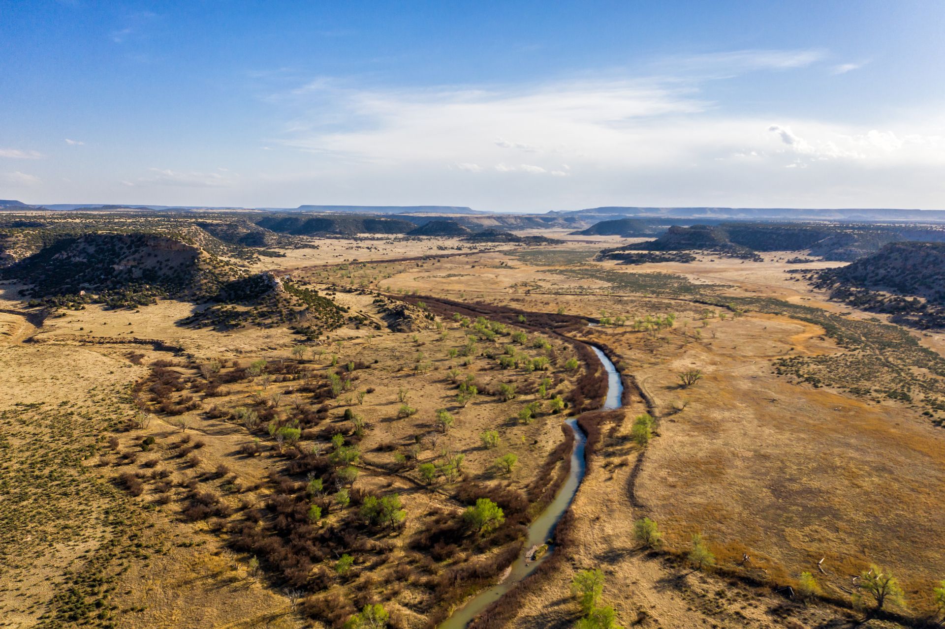 An aerial shot of Comanche National Grassland, which is a vast canyon filled with prehistoric artifacts