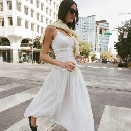 A model wearing a white maxi dress from Abercrombie 