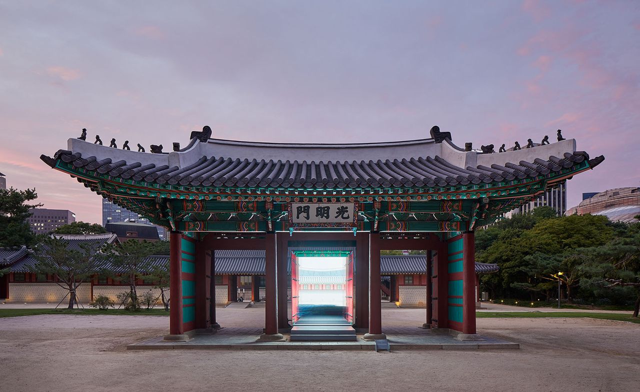 structure with grey roof and green walls inside