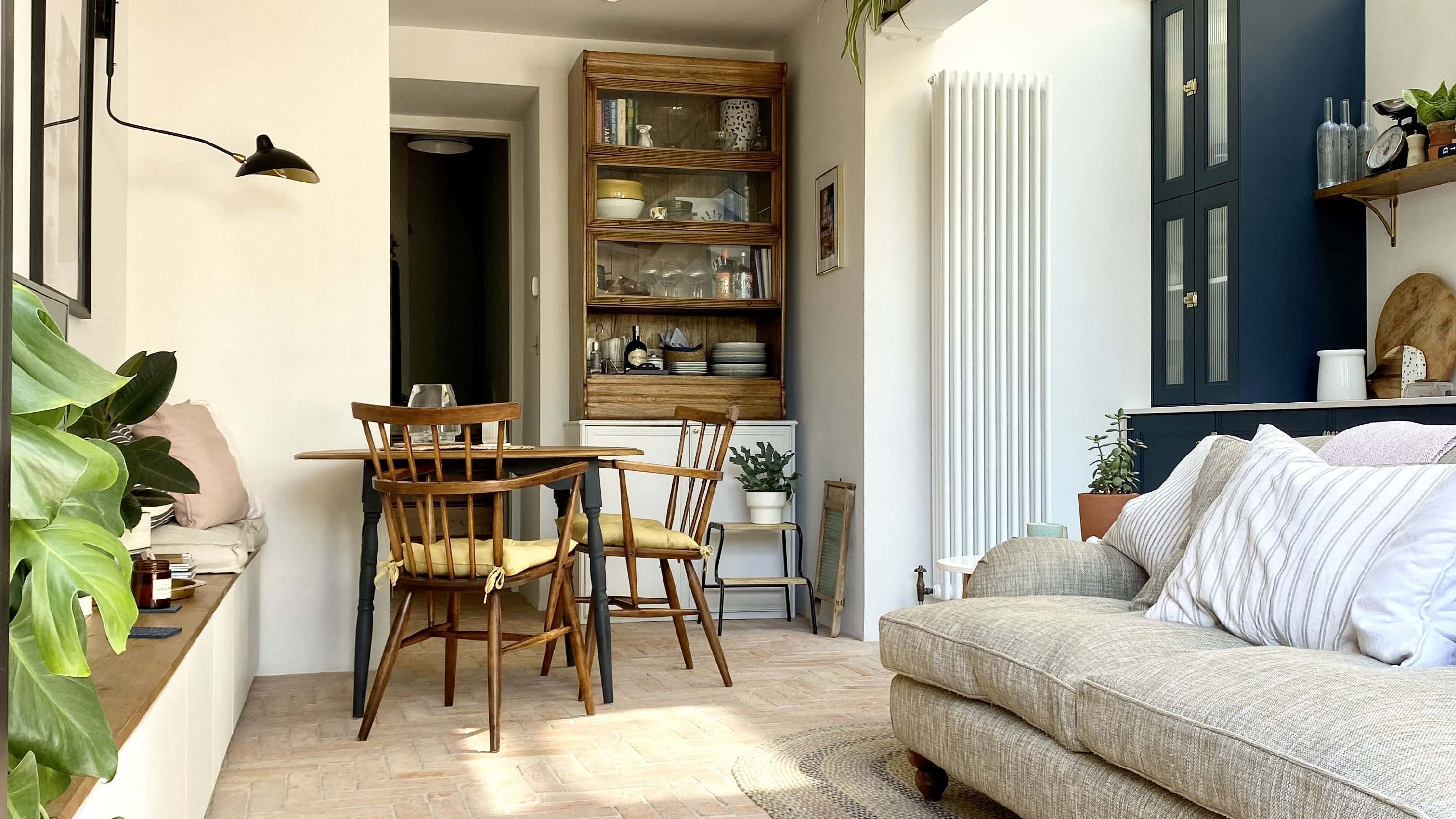 living room with dining table and terracotta floor tiles