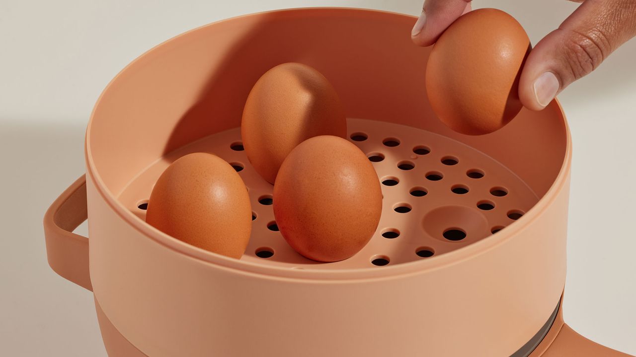 Our Place Perfect Power Pot in Spice colorway showing eggs