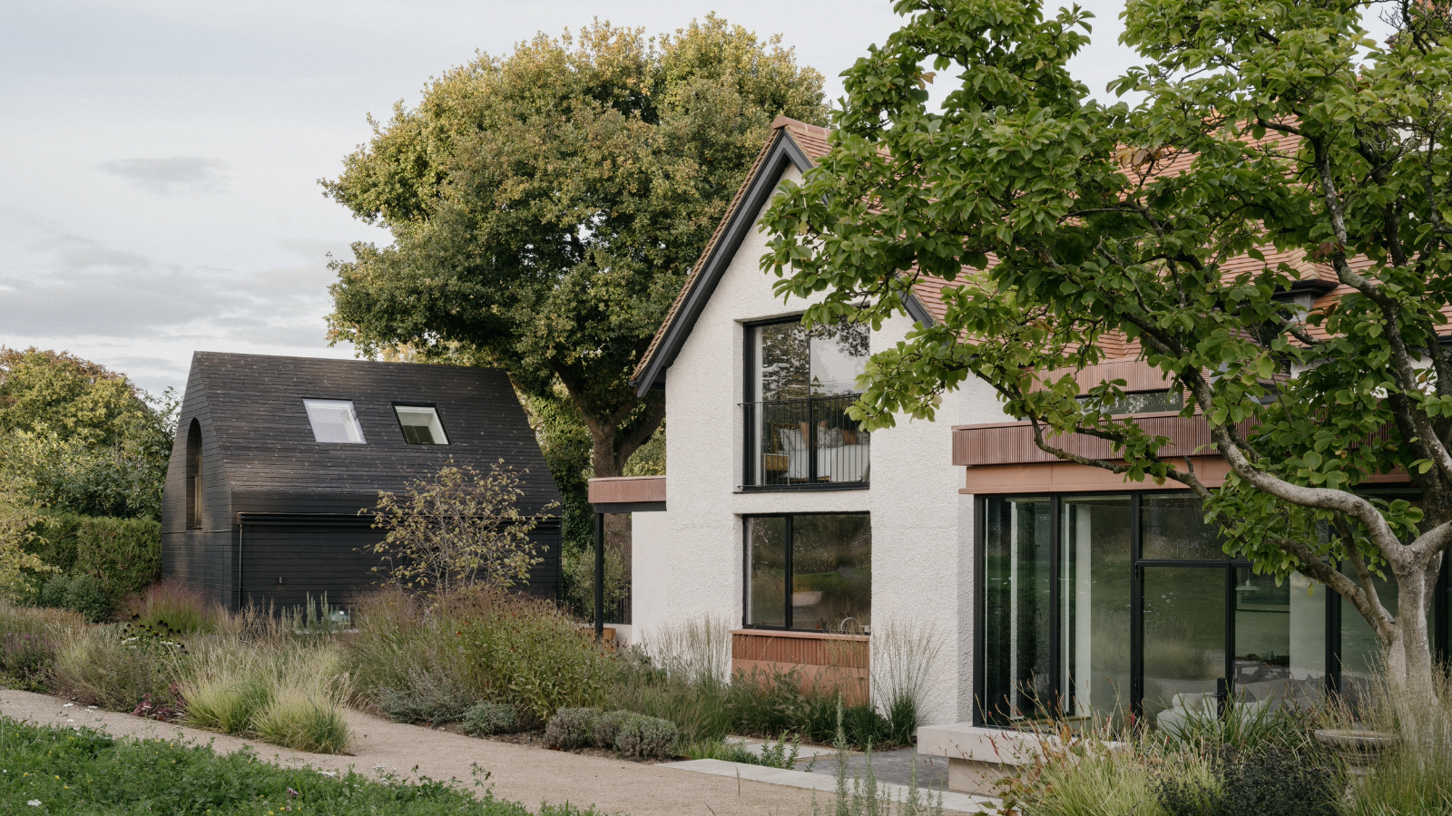 TE Residence, UK, by Dedraft, a leafy garden villa