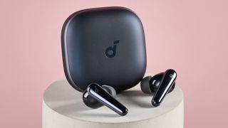 Anker Soundcore Liberty 5 charging case with earbuds balanced in front