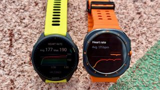 The Samsung Galaxy Watch Ultra (right) and Garmin Forerunner 965 (left) showing heart rate averages after a track run.