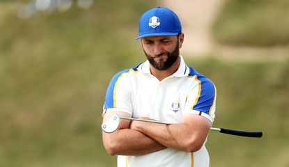 Rahm scowls while holding his putter