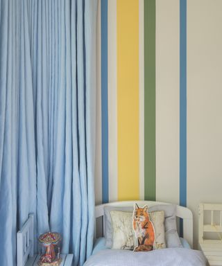 paint color schemes for kids' rooms, kid's room with blue, green and yellow scheme, stripes on wall, blue curtain, bed,