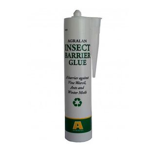 Bottle of insect barrier glue with a nozzle head on a white background