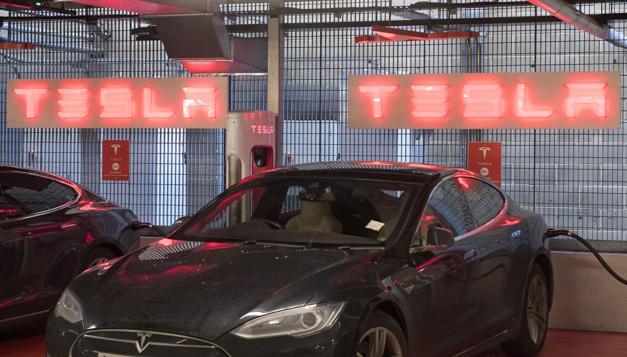 Tesla electric cars in a charging station