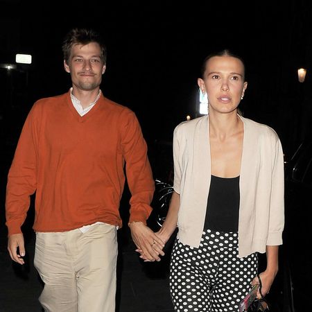 Millie Bobby Brown wearing a cardigan, polka dot capris, and ballet pumps