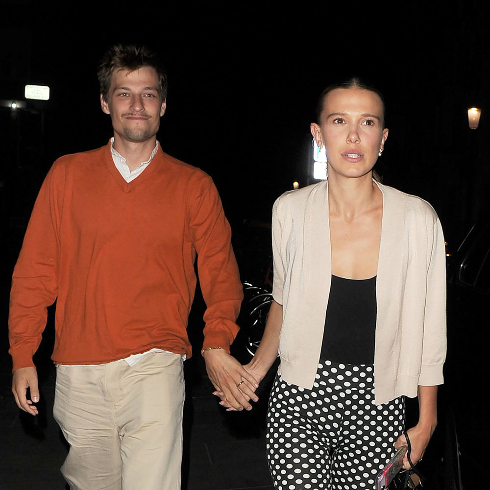 Millie Bobby Brown wearing a cardigan, polka dot capris, and ballet pumps