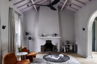 A purple ceiling paired with grey rug