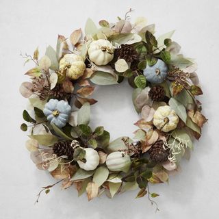 Blue and white pumpkins on a wreath