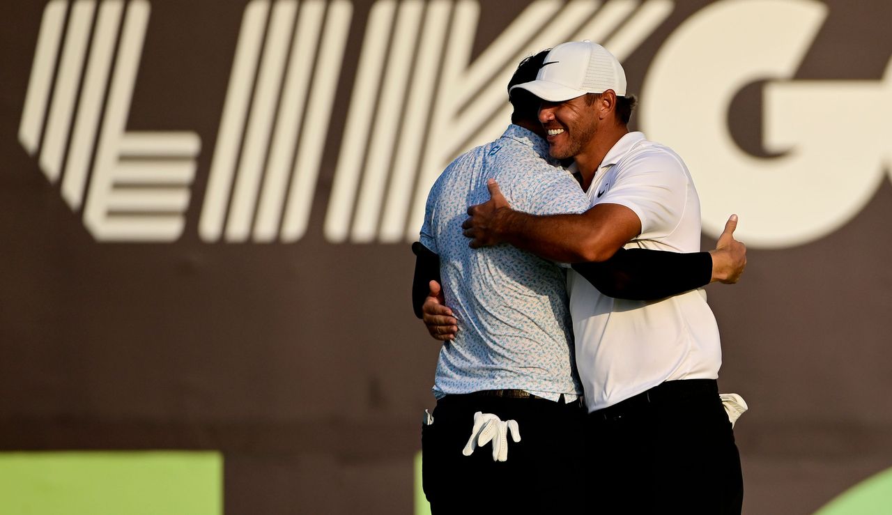 Koepka hugs Uihlein on the 18th hole