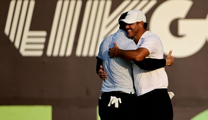 Koepka hugs Uihlein on the 18th hole