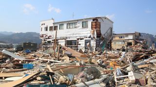 The Great East Japan Earthquake in Iwate. Here we see the remains of a house amongst a lot of rubble after an earthquake.