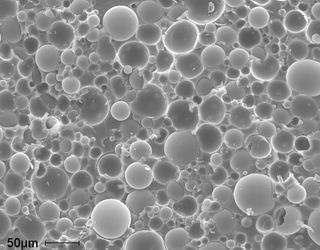 A typical syntactic foam comprised of glass, hollow particles filled with vinyl ester resin, as viewed by a scanning electron microscope. The particles are on average 40 microns (0.04 mm) in diameter.