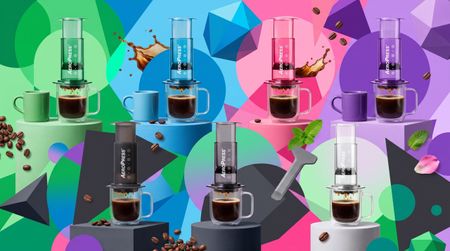 Collection of colorful AeroPress coffee makers on multicolored abstract background