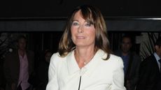 Carole Middleton wears a white tie front jacket as she arrives at The Palladium Theatre on October 10, 2011