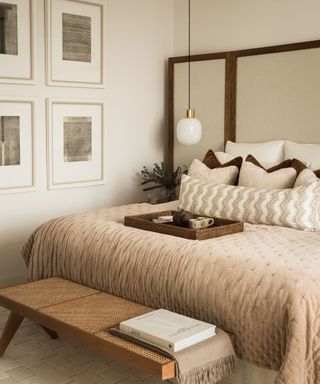 A neutral bedroom with thick comforter