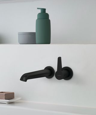 Black wall mounted bathroom faucet by Laufen