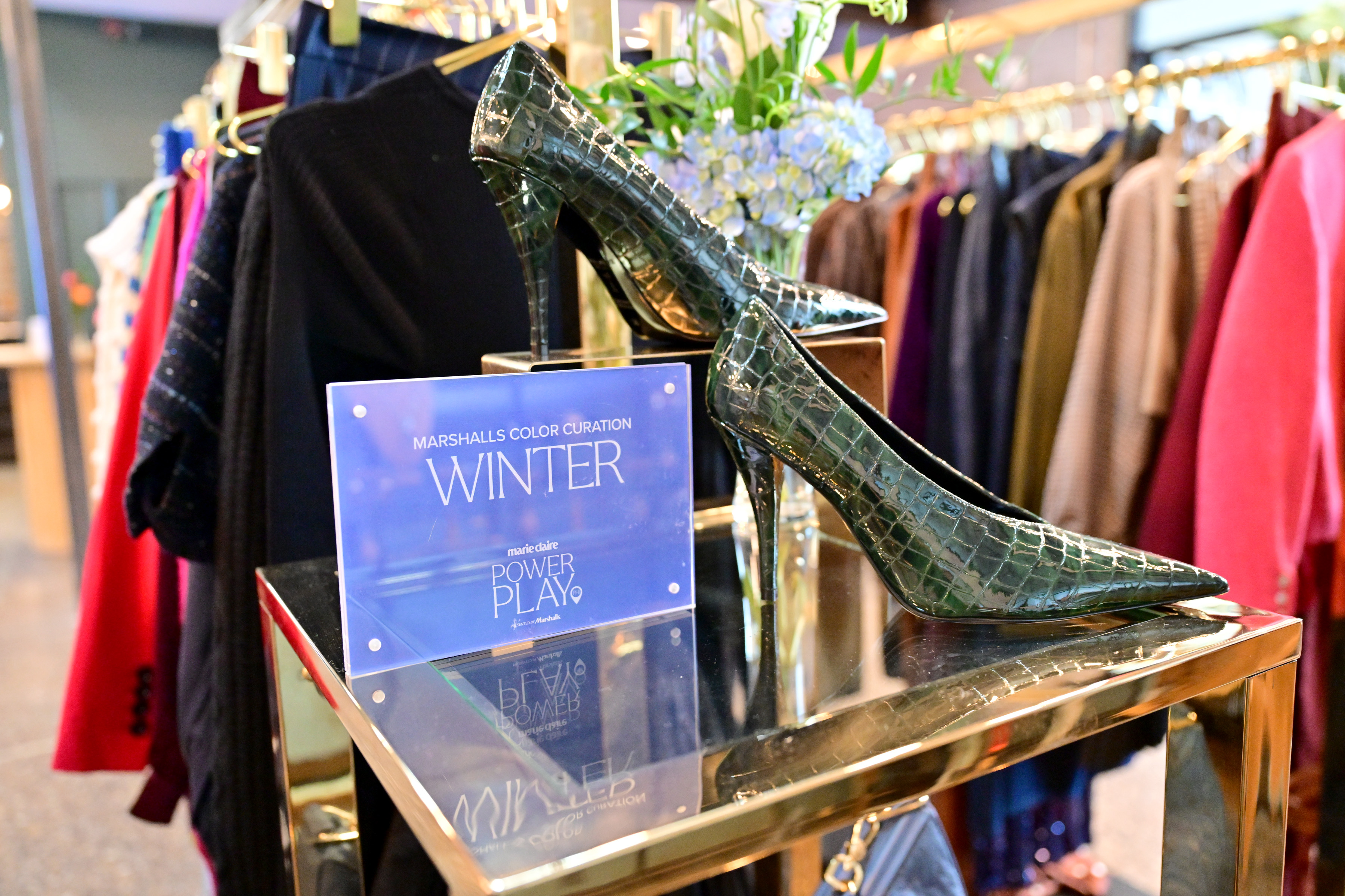Close-up of green high heels displayed beside a &amp;ldquo;Winter&amp;rdquo; sign at the Marshalls Color Curation setup during Marie Claire&amp;rsquo;s Power Play summit.