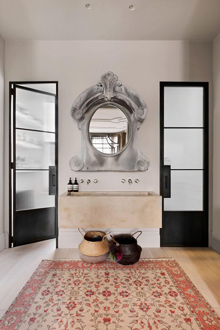 Bathroom with large Persian style rug and Crittall doors