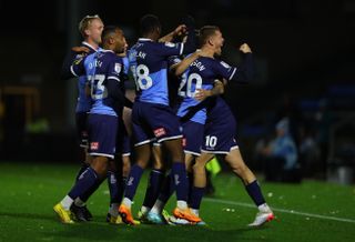 Wycombe Wanderers celebrate a goal against Port Vale in November 2022.