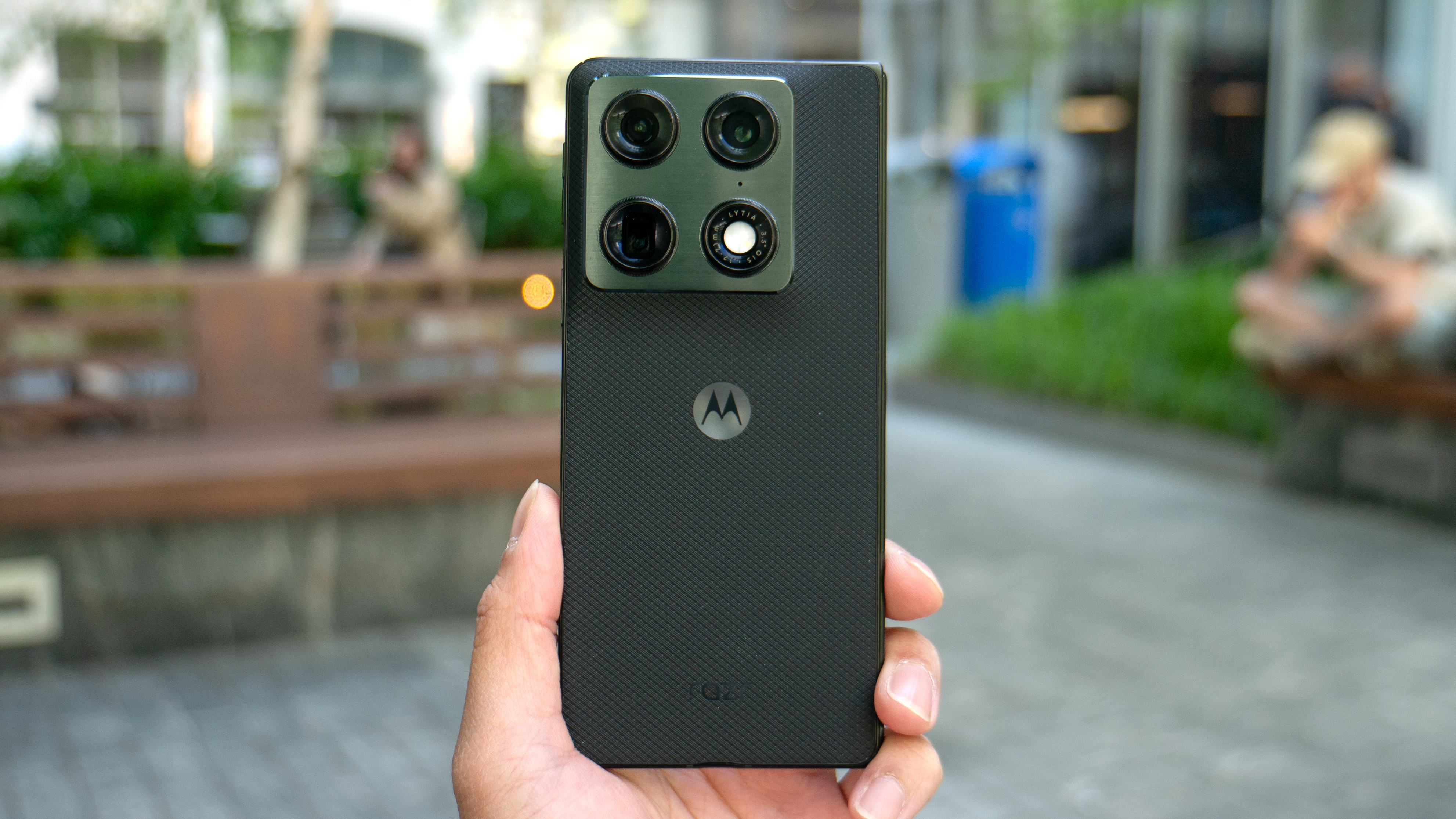 Motorola Razr Fold held in the hand showing the back.