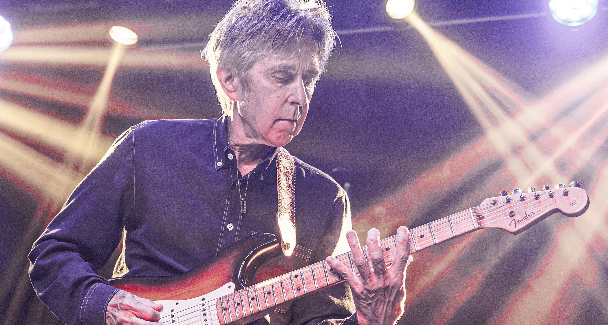Eric Johnson plays onstage with a Fender Stratocaster.