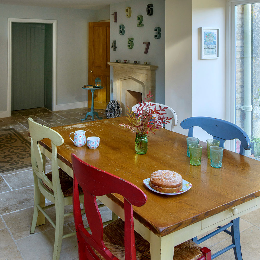 dining area with numbers on wall and cake and glasess