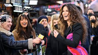 Sandra Bullock nearly ties Julia Roberts as the Hollywood actress with the highest grossing movies