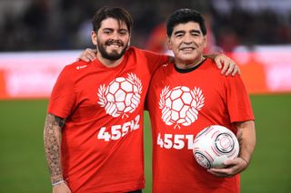 Diego Maradona (right) pictured with his son Diego Maradona Jr. at a match for peace in 2016.