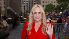 rebel wilson wearing a red jumpsuit