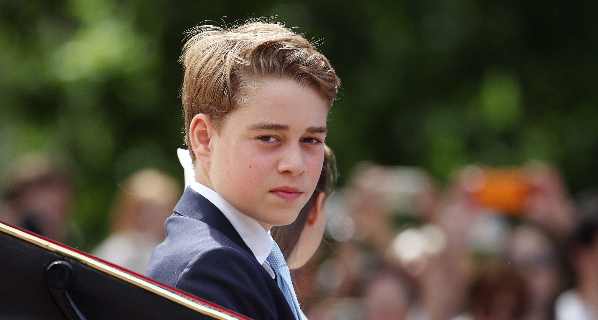 Prince George riding in a carriage