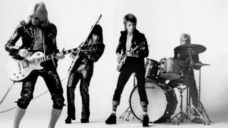 Guitarist Mick Ronson, bassist Trevor Bolder, David Bowie and drummer Mick Woodmansey of "Ziggy Stardust And The Spiders From Mars" pose for a portrait in November 1972 in London, England.