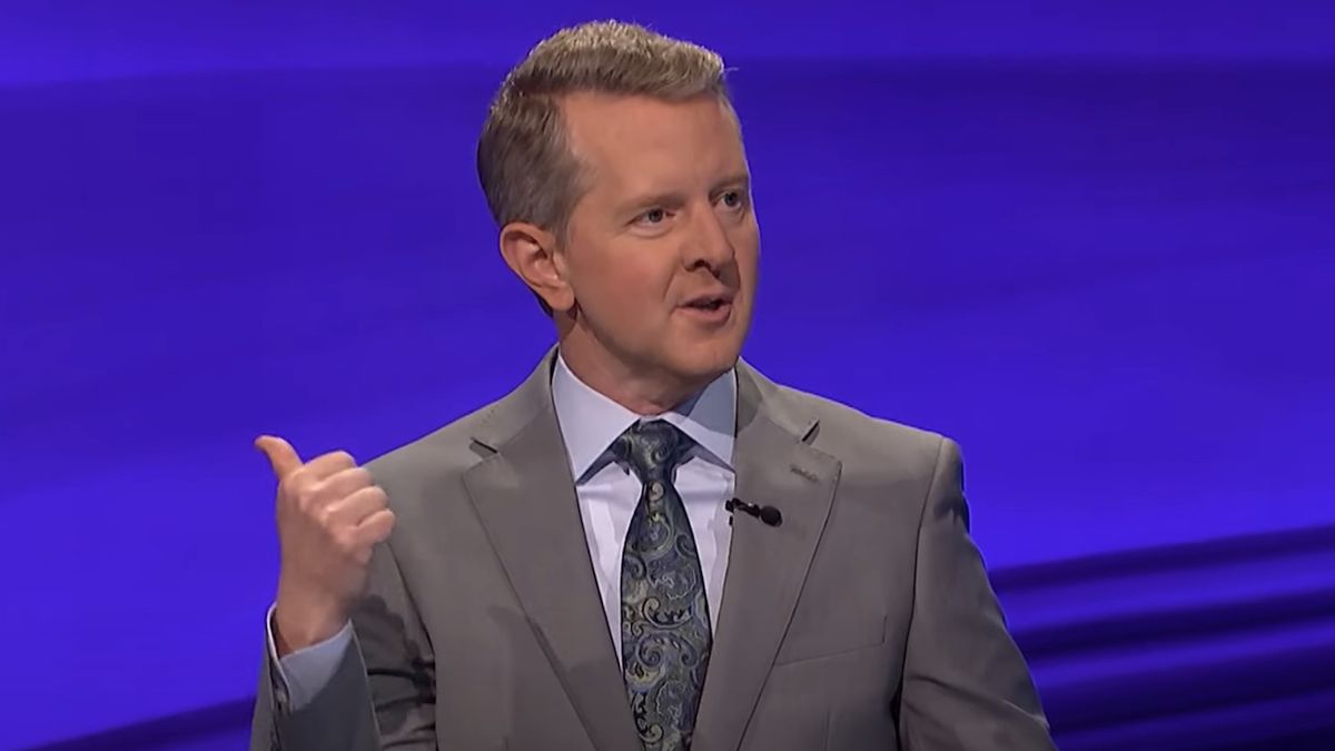 Screenshot of Ken Jennings pointing to the game board with his thumb on Jeopardy!