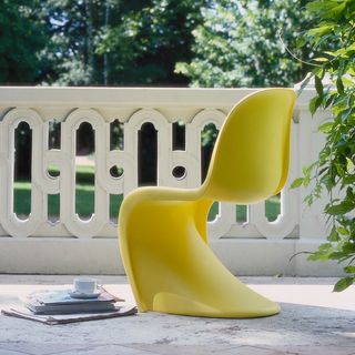 panton chair with garden room and tree