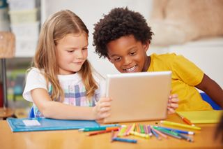 Boy and girl at laptop computer