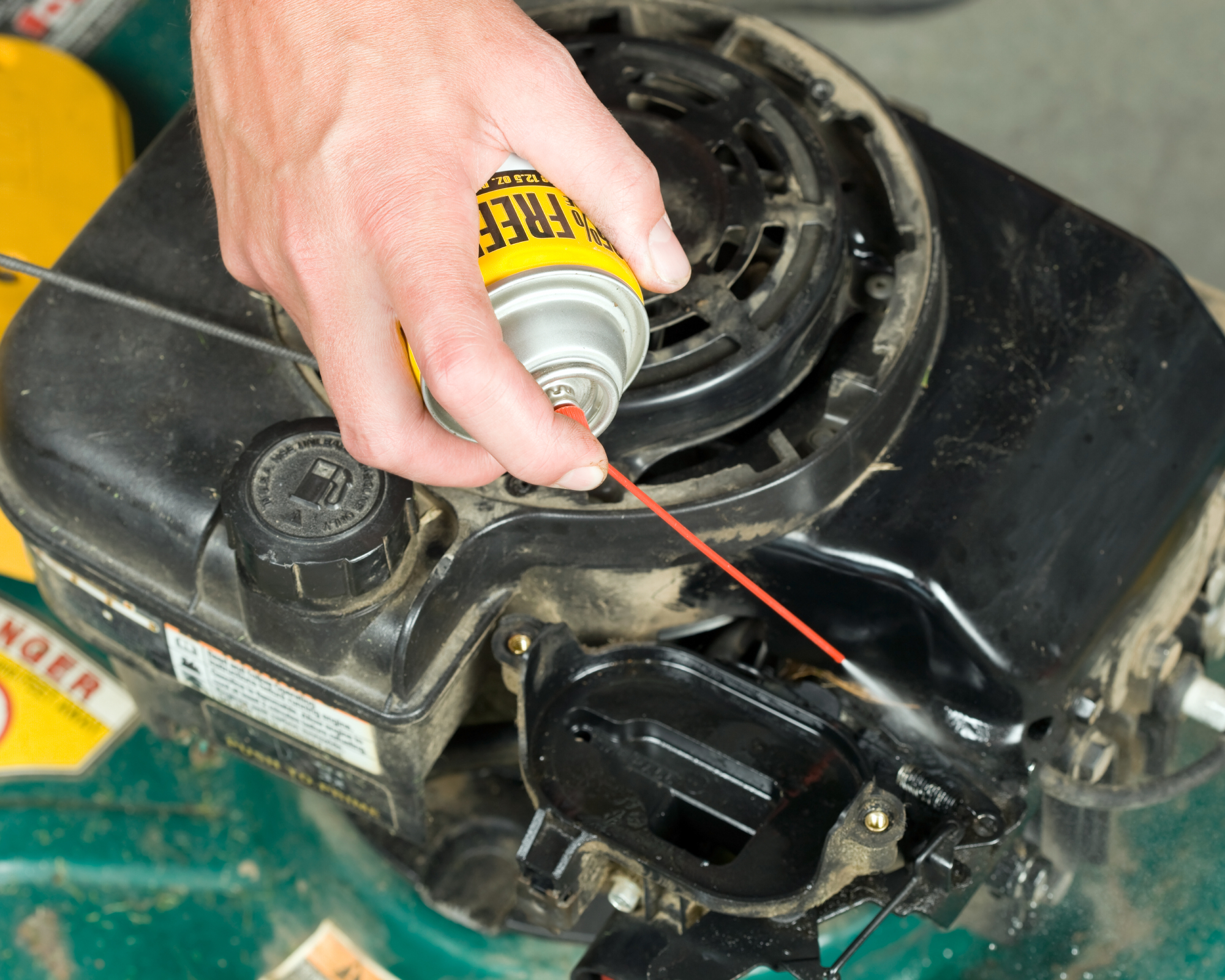 hand cleaning lawn mower engine