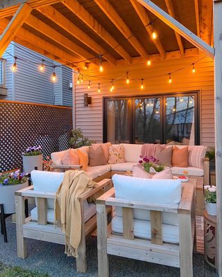 Outdoor patio with string lights and sofa