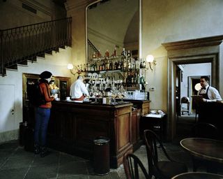 Dror For Tumi Milan - woman alone at a bar counter