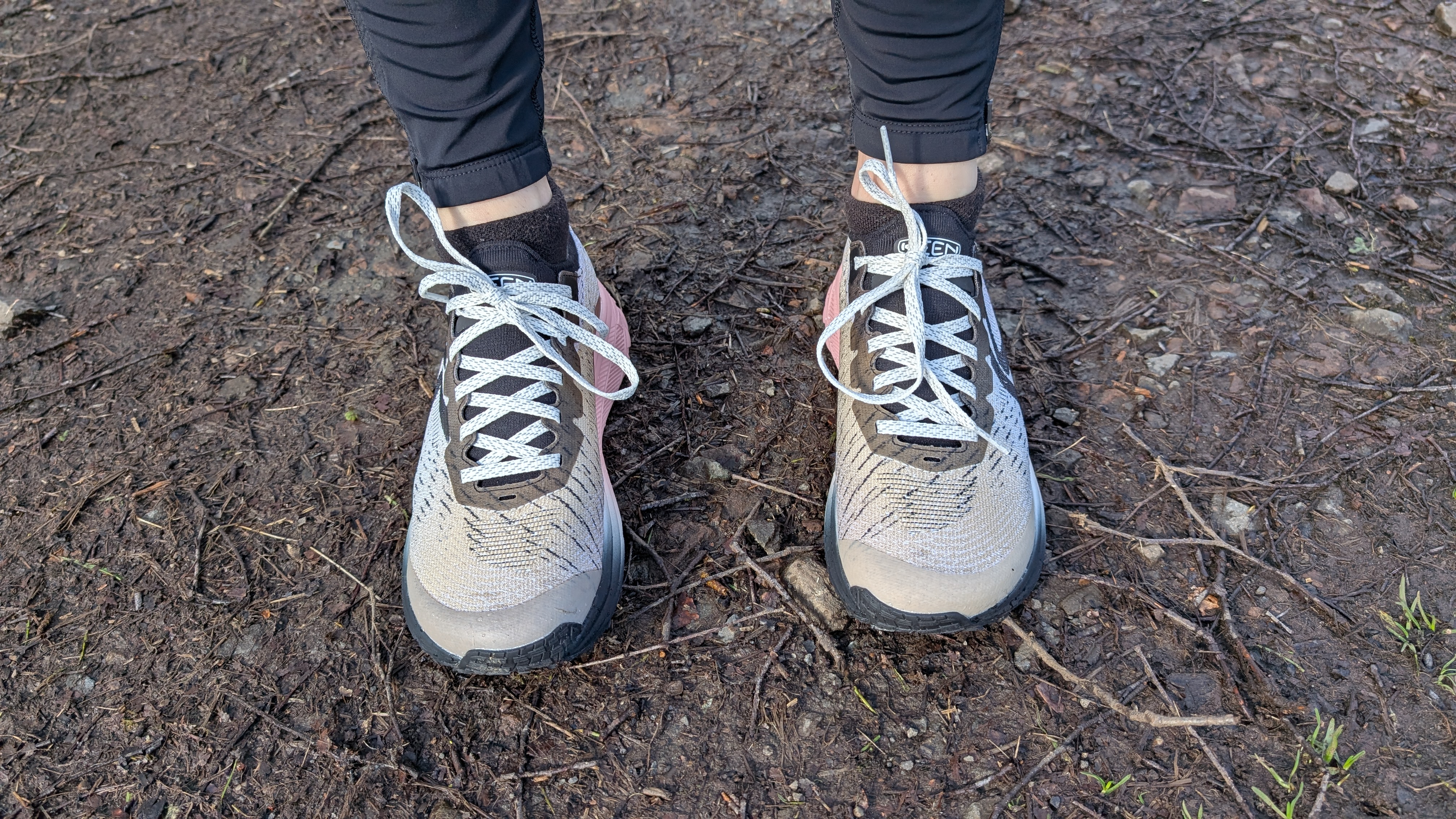 A runner's feet wearing the Keen Seek trail running shoes