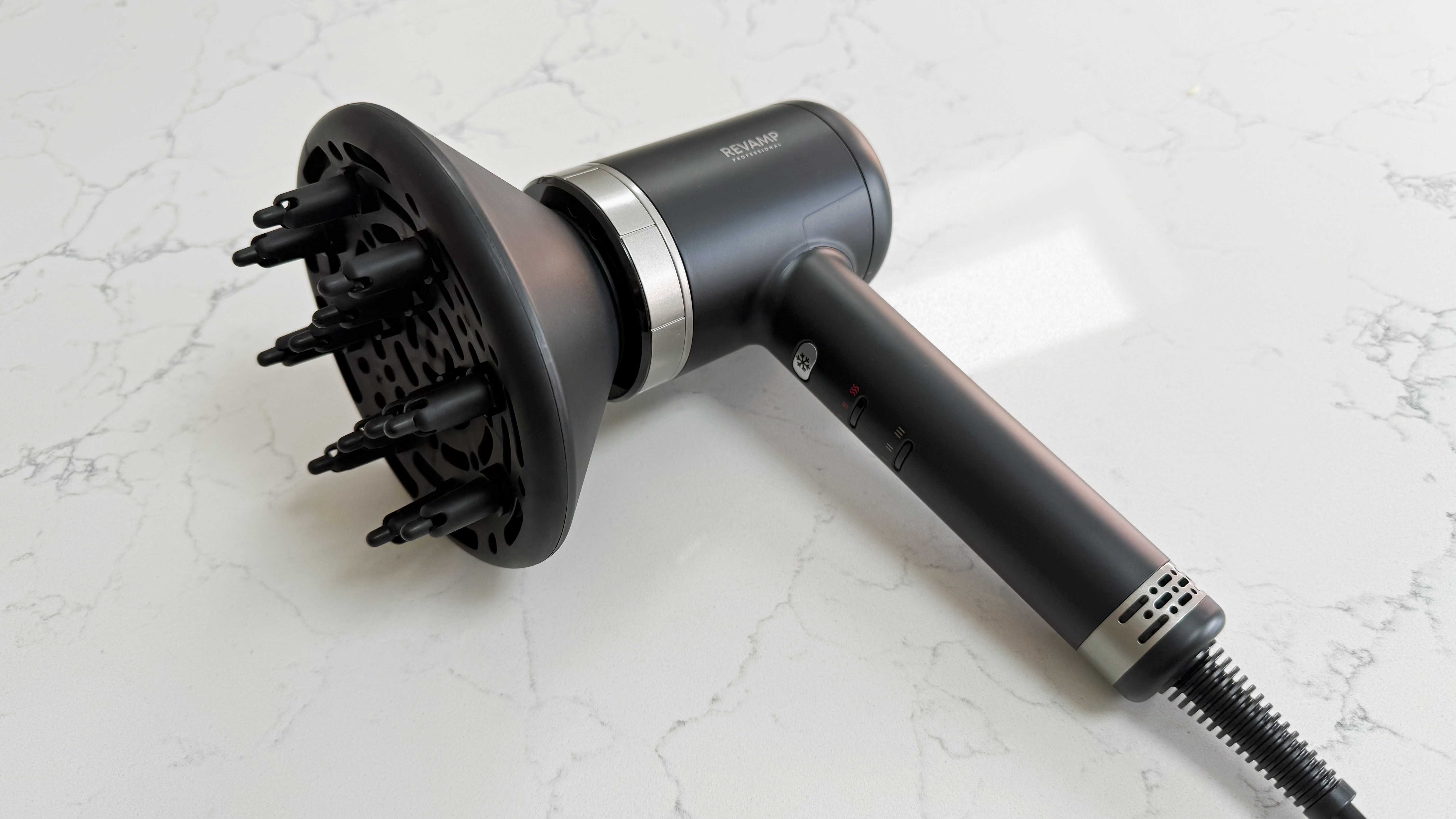 Revamp Tri-Care hair dryer fitted with a diffuser attachment, shown at an angle