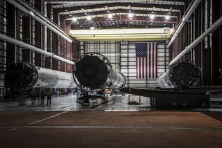 Shot of SpaceX’s three landed Falcon 9 first stages in a hangar at Kennedy Space Center’s Launch Complex 39A. Photo taken May 14, 2016.