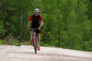 Cycling Weekly magazine editor Simon Richardson on a Cannondale Topstone gravel bike in Sweden. He is wearing orange shoes.