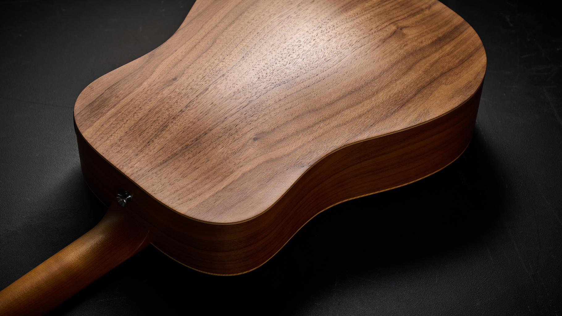 The arched back of the Taylor BT1e Baby Taylor 3/4 acoustic guitar