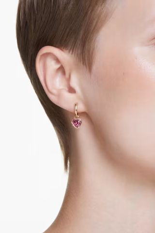 woman wearing heart pink crystal drop earrings