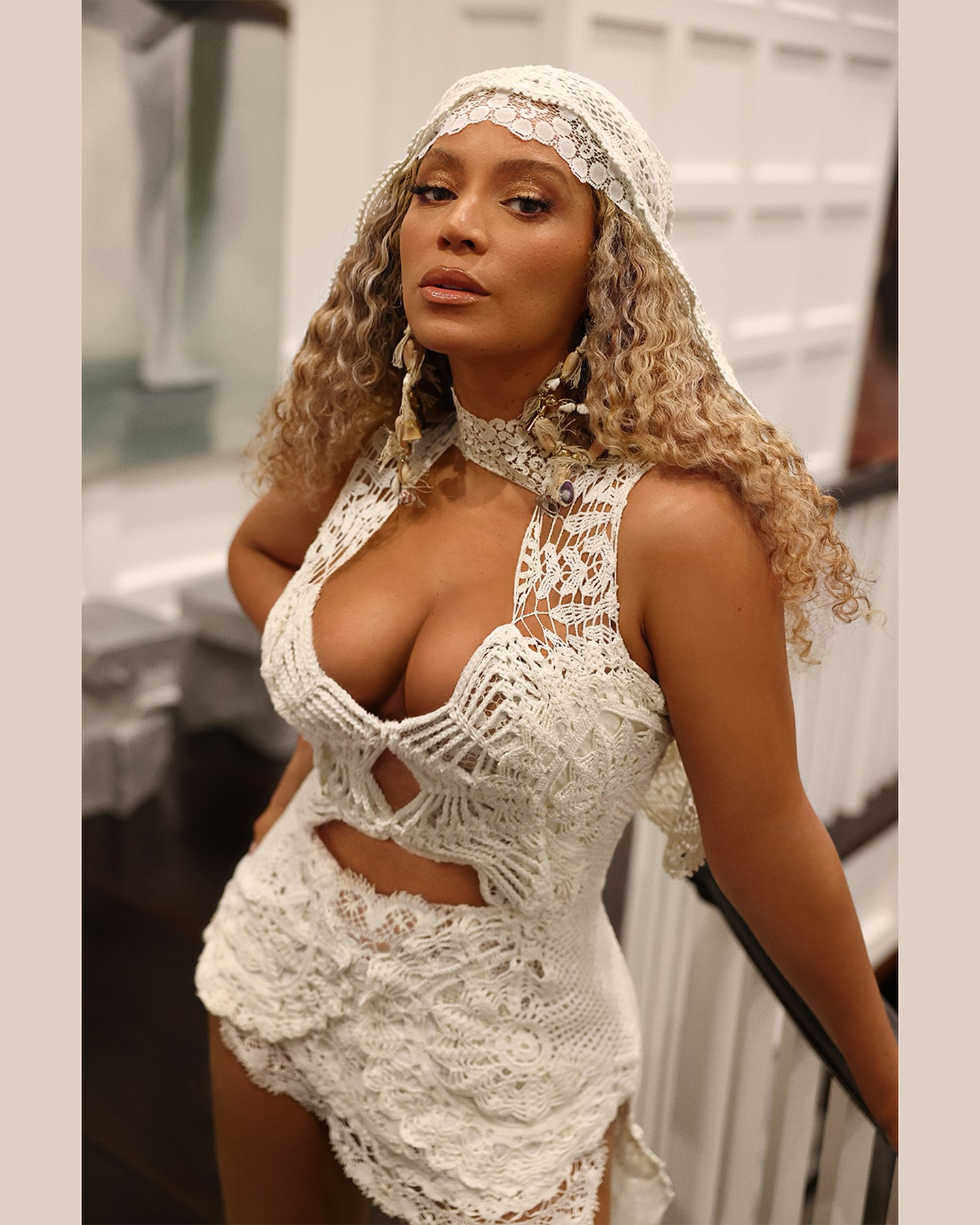@beyonce wearing a white lace outfit with butterscotch blonde hair